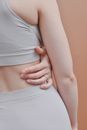 Back and Arm of Woman Touching her Waist