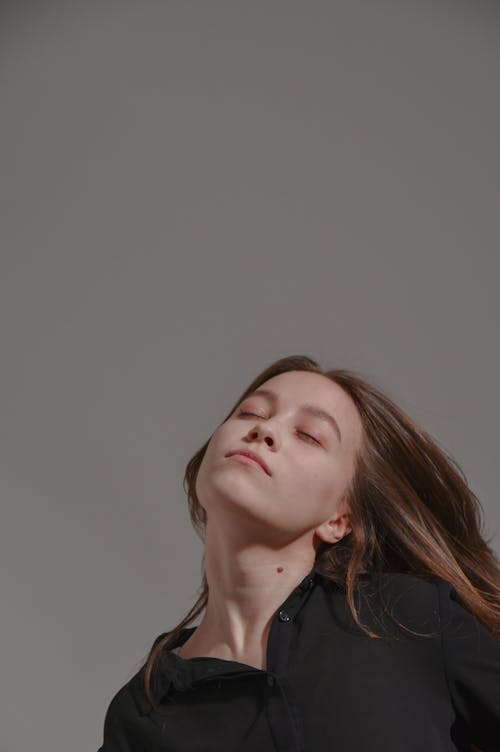 A Woman in Black Long Sleeve Shirt