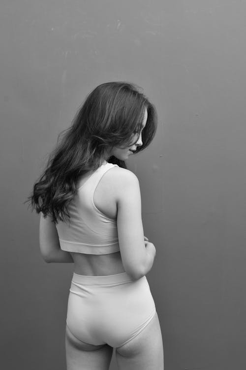 Grayscale Photo of a Woman Wearing Underwear