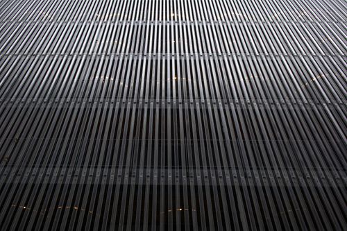 Free Close-up view of a modern skyscraper facade with vertical lines in London. Stock Photo