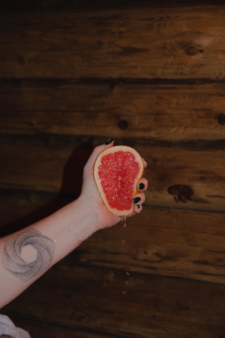 Hand Squeezing A Grapefruit 