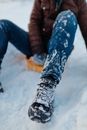 Man with a Sled Sitting on Snow