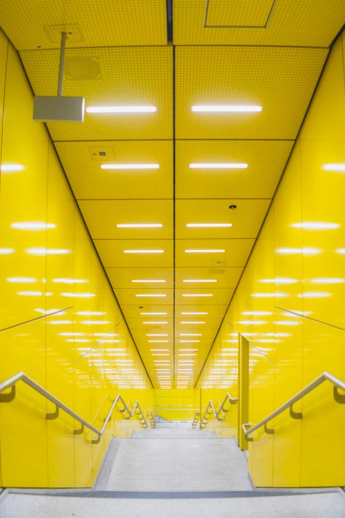 Free Bright yellow underground staircase in Munich with modern lighting and design. Stock Photo