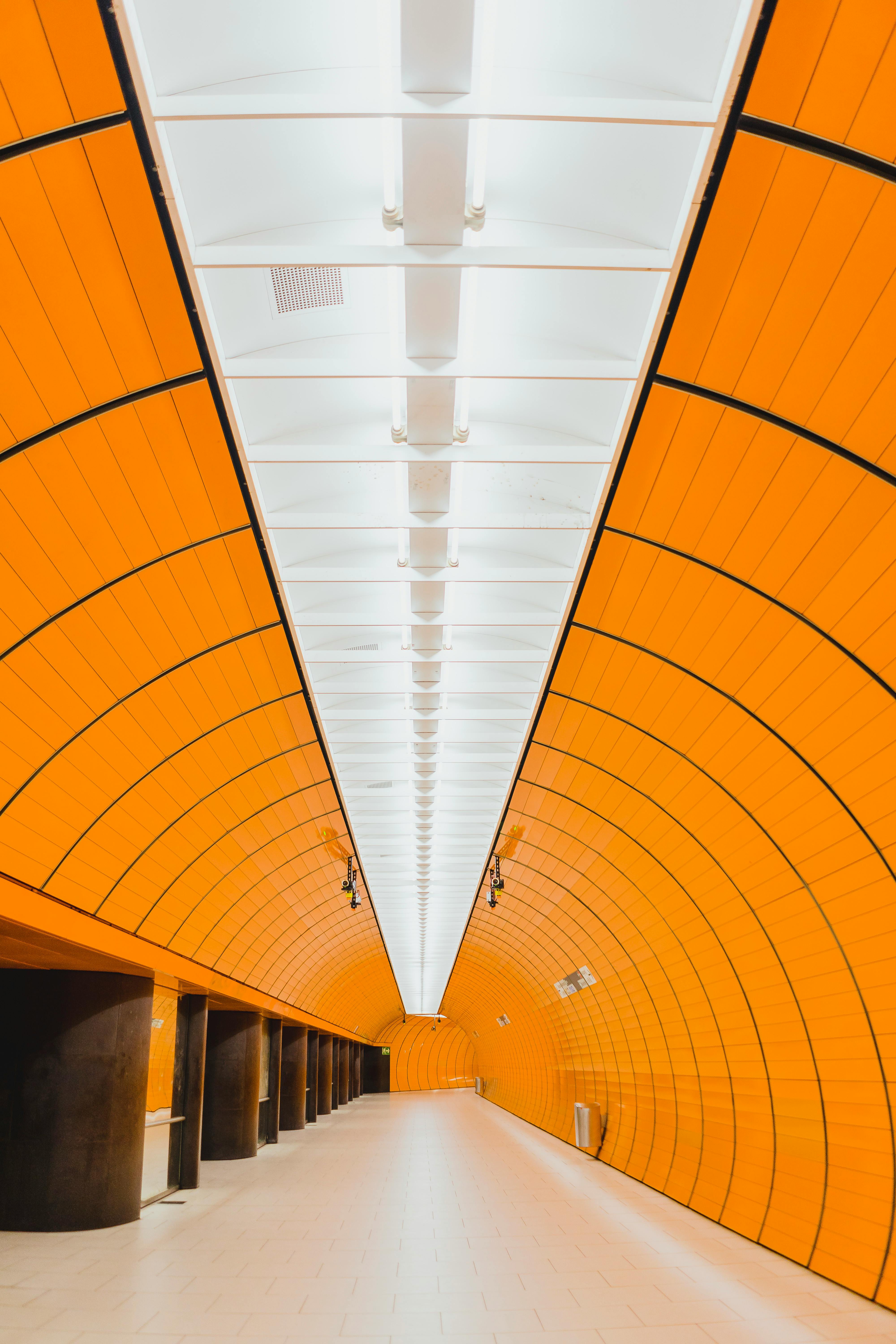 Bright and futuristic yellow tunnel of Marienplatz station in Munich, Germany.