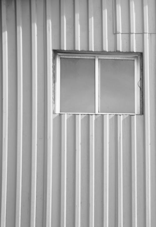 Black and White Photo of a Window on a Wall