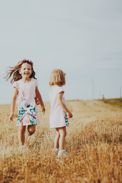 Girls in the Grass Field