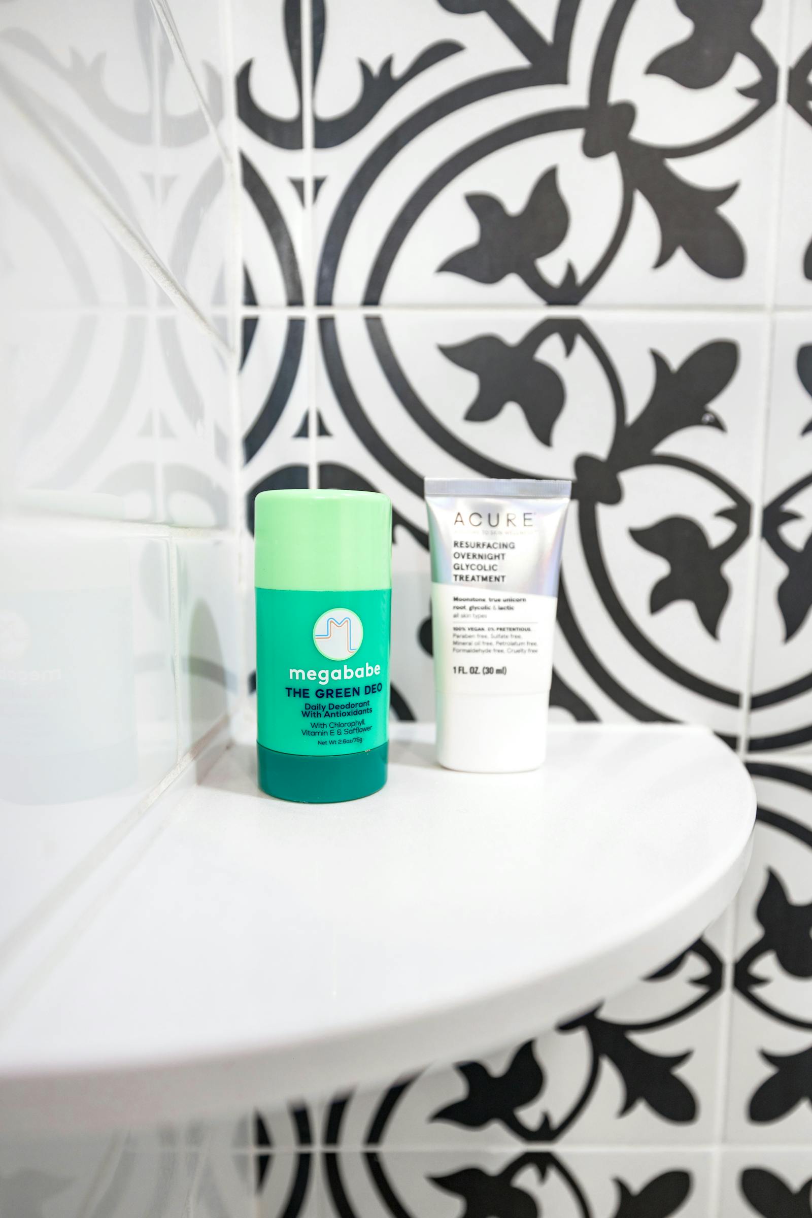 Skincare products neatly arranged on a bathroom shelf, supporting a simple routine