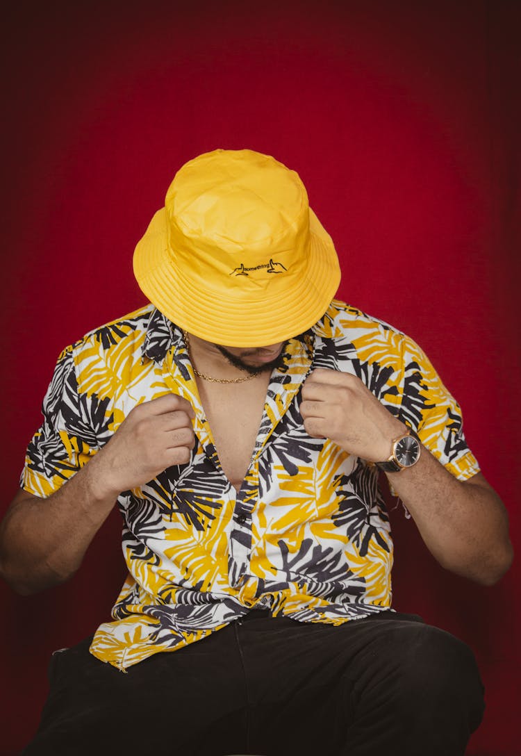 Man In Button Up Shirt Wearing Yellow Bucket Hat