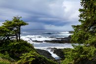 Dramatic ocean view with storm clouds over the rocky coast of British Columbia.