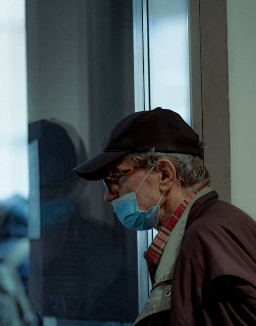 Man in Cap, Mask and with Eyeglasses