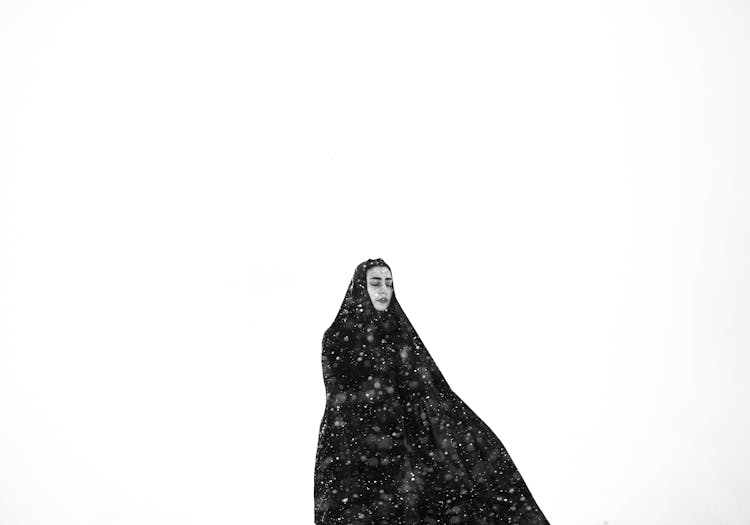 Woman Dress In Black Standing In The Snow 