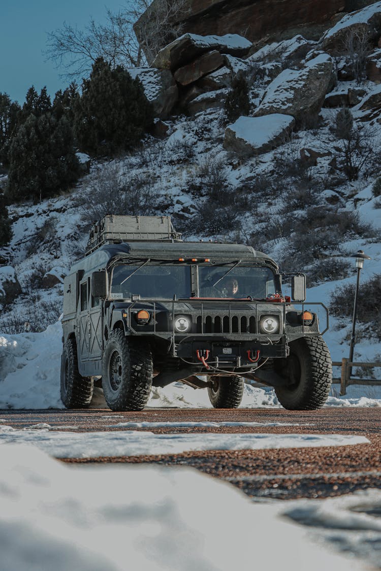 Black Military Vehicle Parked On Roadside