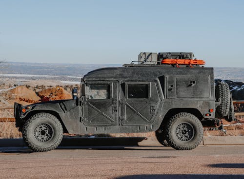 A High Mobility Multi Purpose Wheeled Vehicle Parked in the Roadside