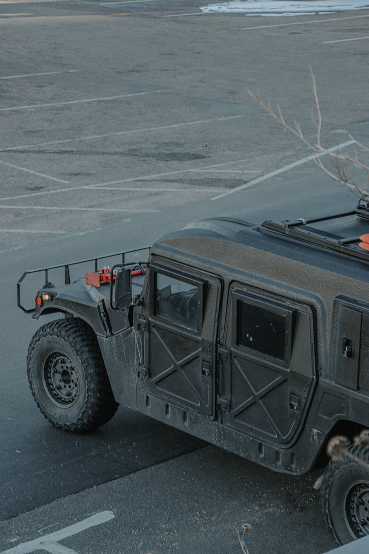 A Hummer Parked In A Parking Lot