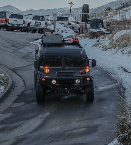 Black Hummer Driving Down the Road