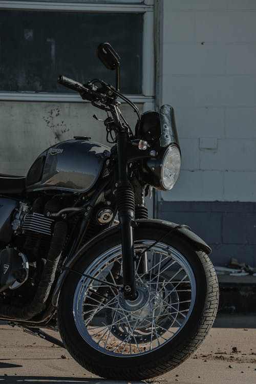 A Black Triumph Motorcycle Parked