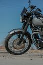 Black and Silver Motorcycle on Brown Dirt Road