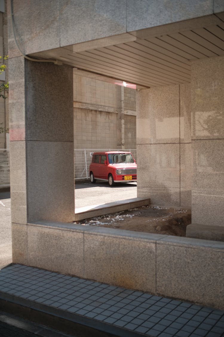 Architectural Construction And Red Car