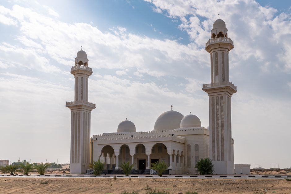 Stunning view of a mosque with domes and minarets in Umm Al Quwain, United Arab Emirates. Stunning view of a mosque with domes and minarets in Umm Al Quwain, United Arab Emirates.
