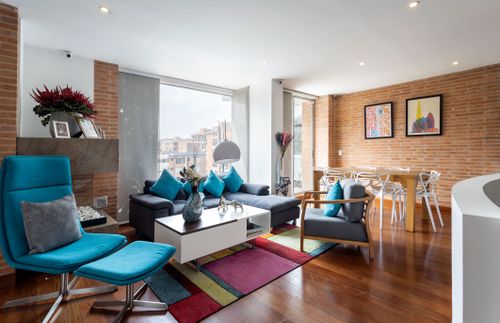 Free Chic living room interior with vibrant decor and modern furniture in Bogota, Colombia. Stock Photo