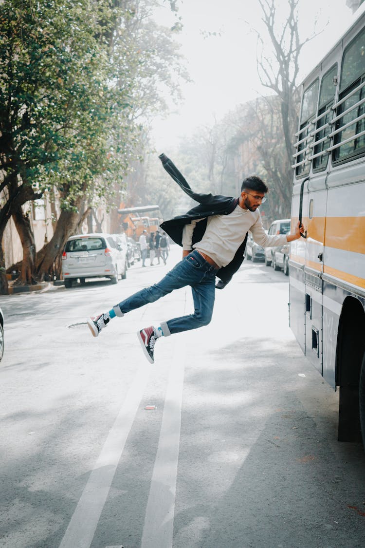 Man Holding Bus Handle On Street