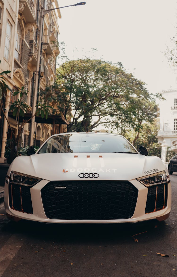 White And Black Audi Parked On Street