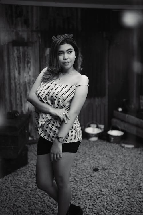 Woman Wearing Striped Tank Top and Shorts