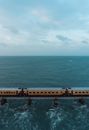 Brown Wooden Dock on Sea Under White Clouds