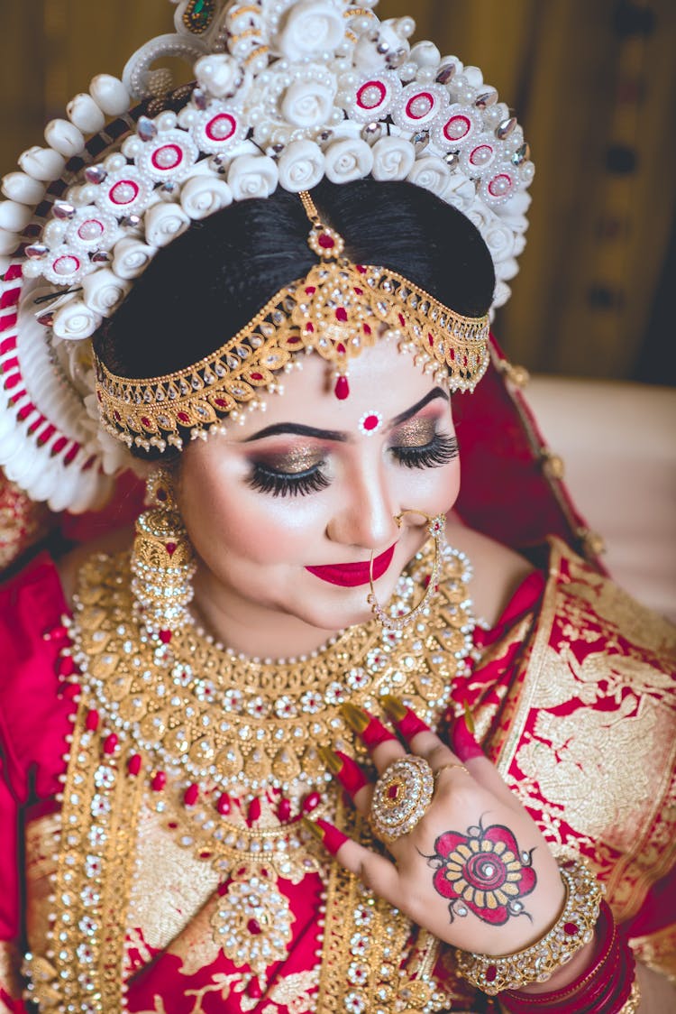 Woman In Red And Gold Dress Wearing A Headdress