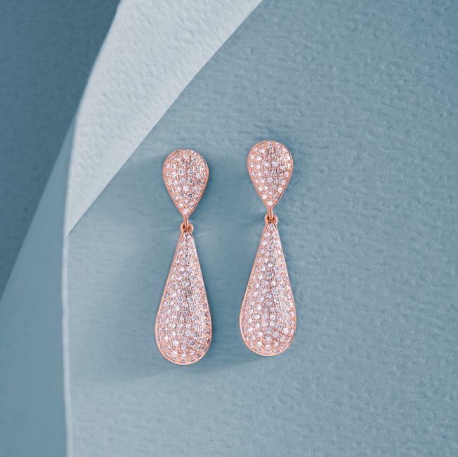 faceted diamond dangle earrings catching light faceted diamond dangle earrings catching light