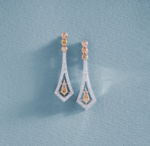 Earrings with Diamonds on Blue Surface