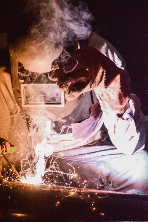 Photo of Person Wearing Welding Mask