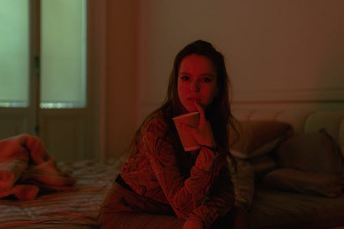 Woman Sitting with Cup