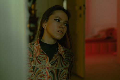 Free A pensive woman in a retro patterned shirt in Istanbul, Turkey. Stock Photo