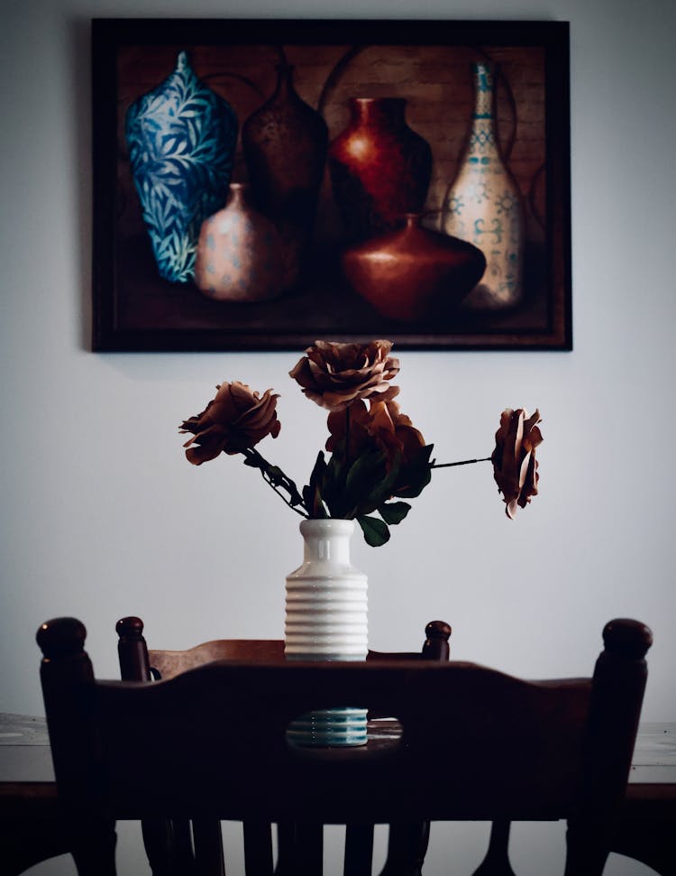 White Ceramic Vase On Brown Wooden Table