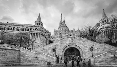 People Walking Near Ancient Building