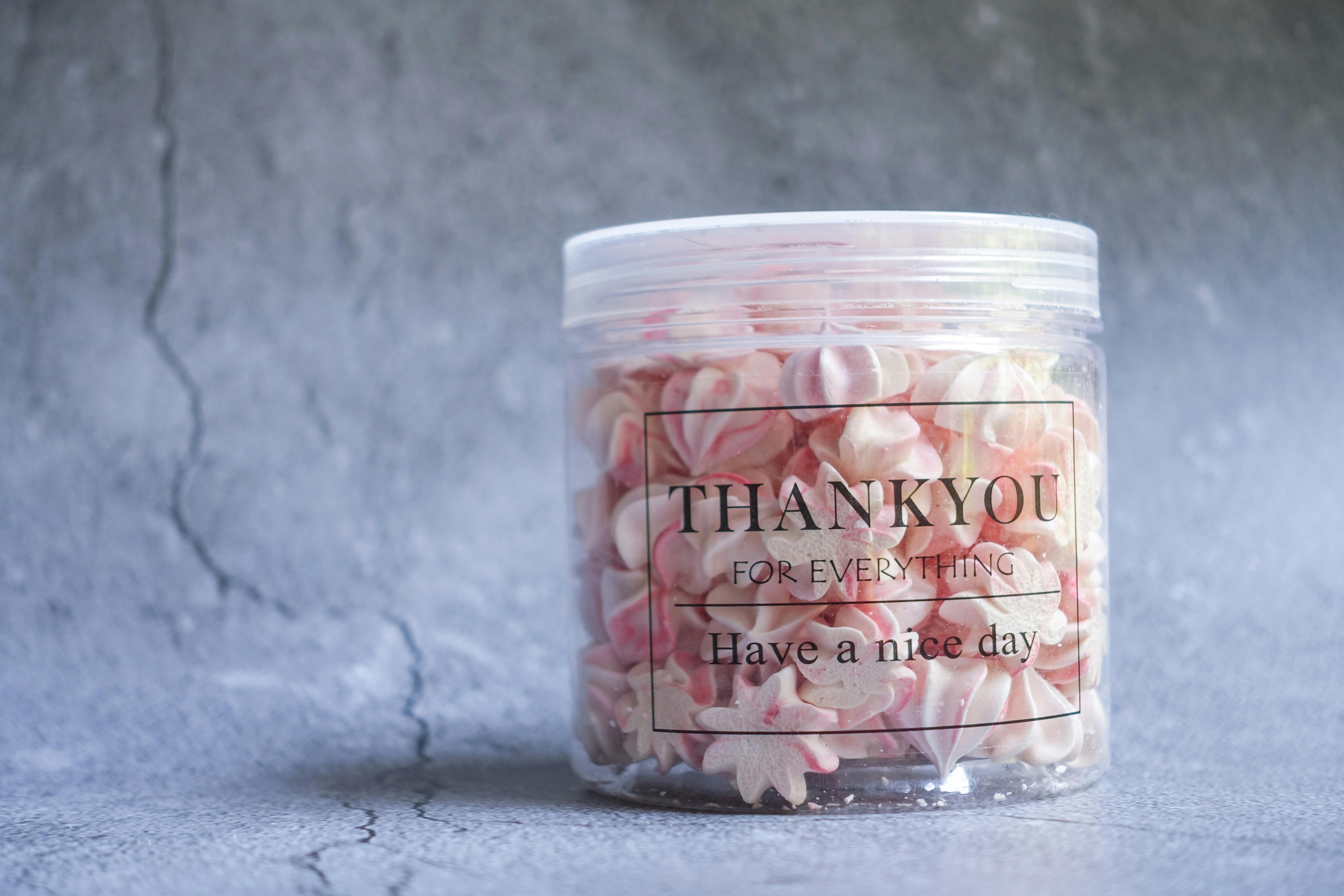 Colorful jar of pink meringue with a 'Thank You' message, perfect for gift ideas.