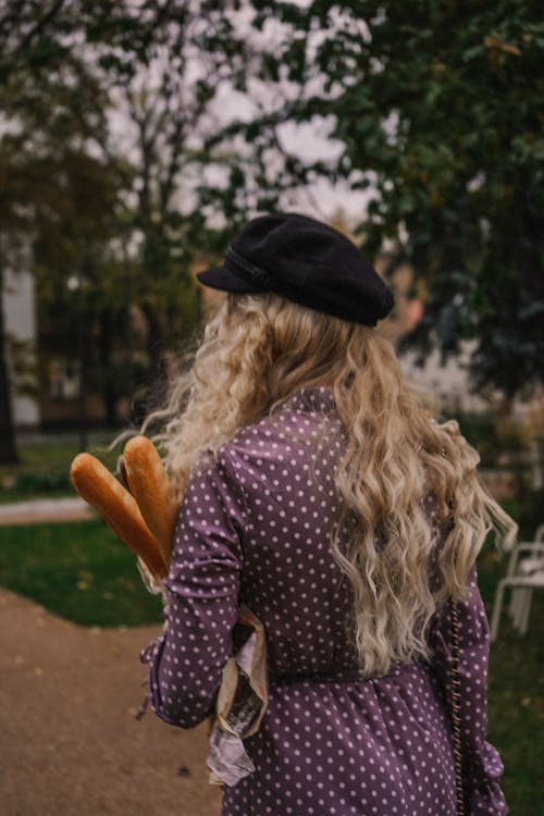Woman in Beret Carrying Baguettes