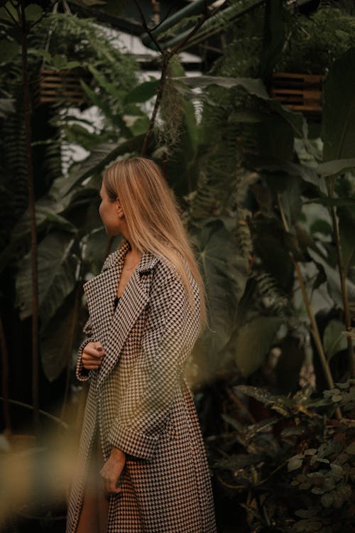 Woman Walking Between Tropical Plants 