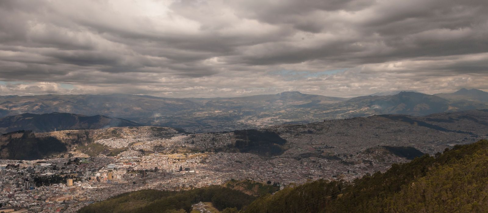 Scenic aerial view of Bogota with clouds and landscape from Monserrate Hill.