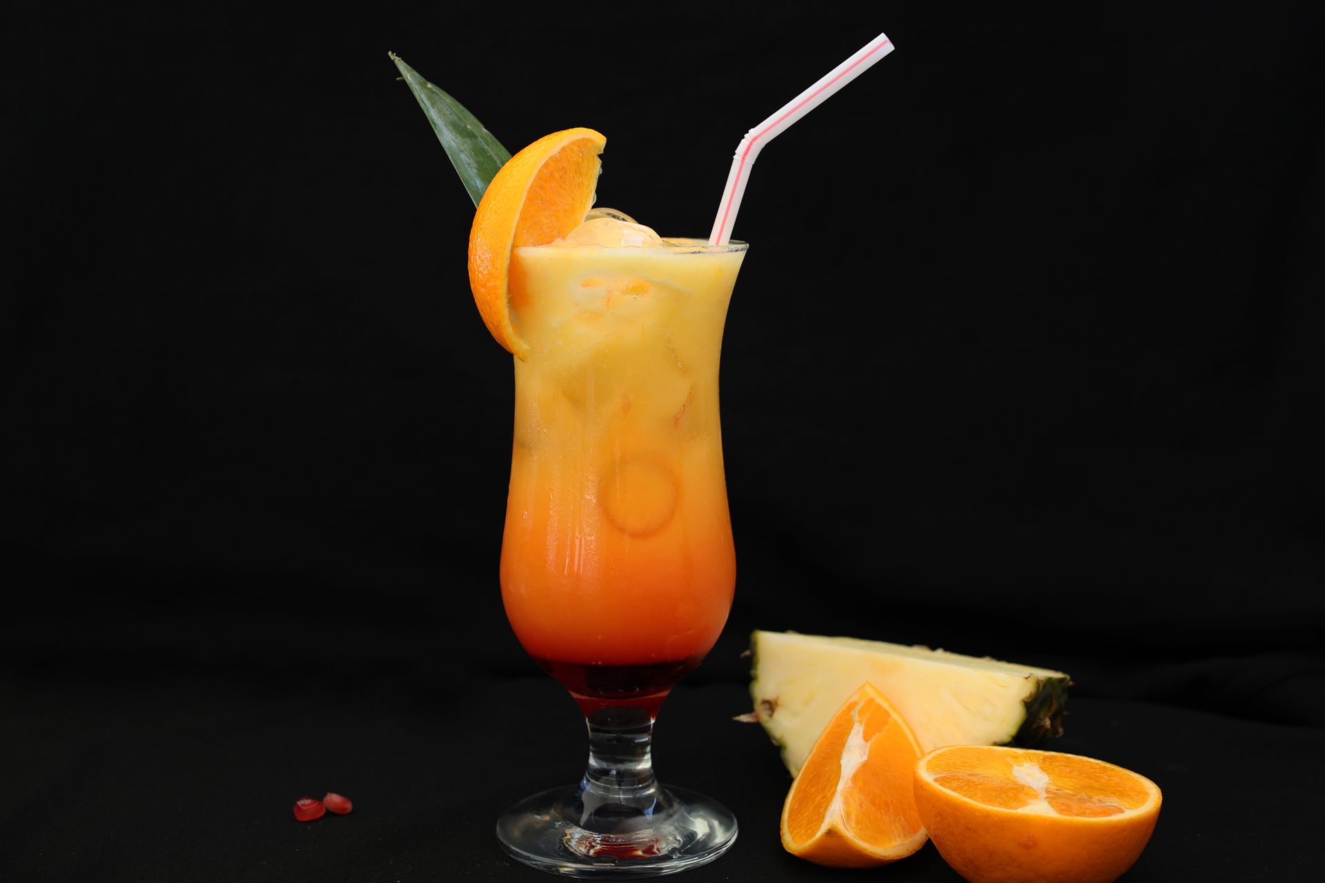 Refreshing tropical cocktail with vibrant orange and pineapple slice, perfect for summer vibes.