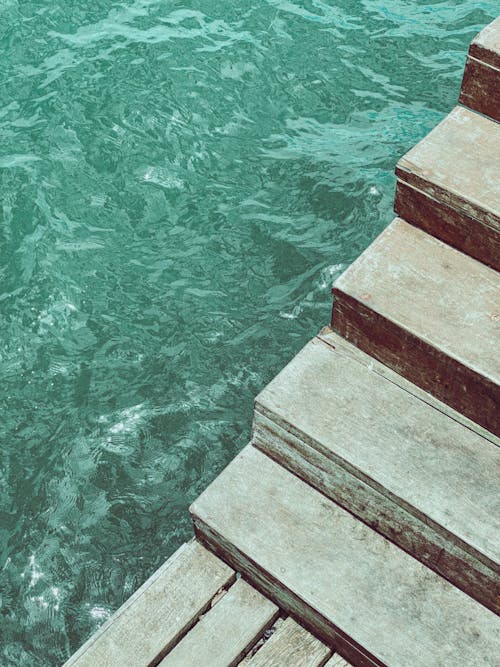High Angle View of Wooden Stairs and Sea Water 