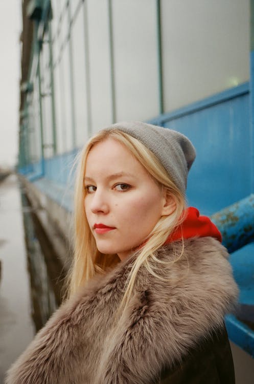 Photo of Woman Standing Beside Truck