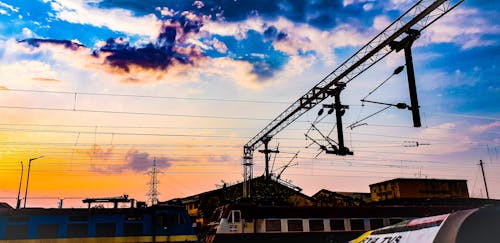 Blue and Yellow Train Photography during Nightfall