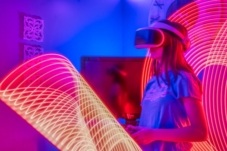 Girl Playing With VR Goggles