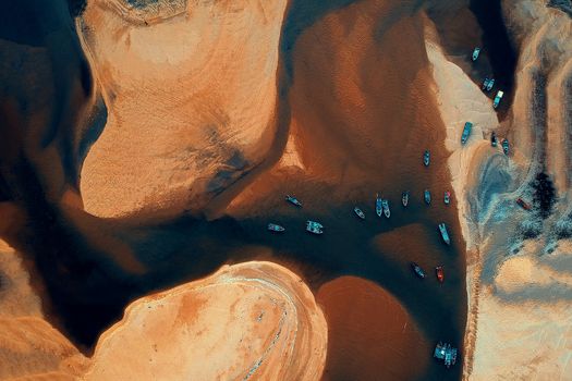 Stunning aerial view of vibrant boats on Kemasik river, Malaysia. Ideal for travel visuals.