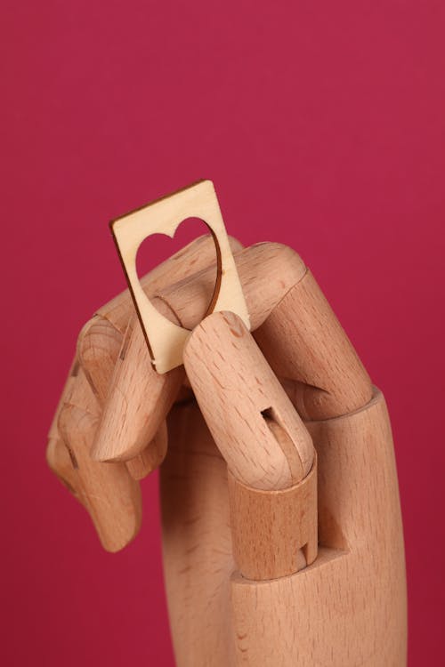 Wooden Piece held by a Wooden Hand