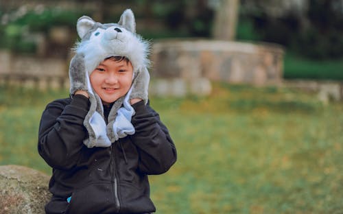 Free Toddler's Wearing Wolf Headgear Stock Photo
