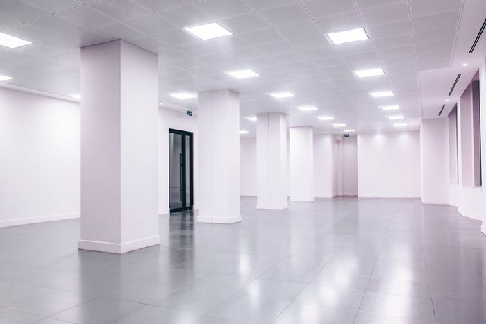 Empty white commercial interior ready for tenant fit-out