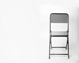 Black Folding Chair in White Background